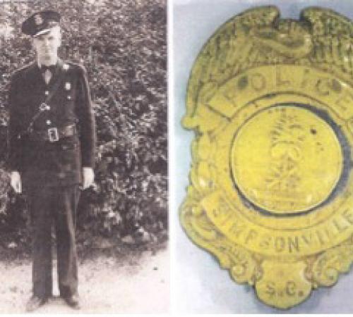 Police Chief Charlie Hamby and the first badge used by the police department