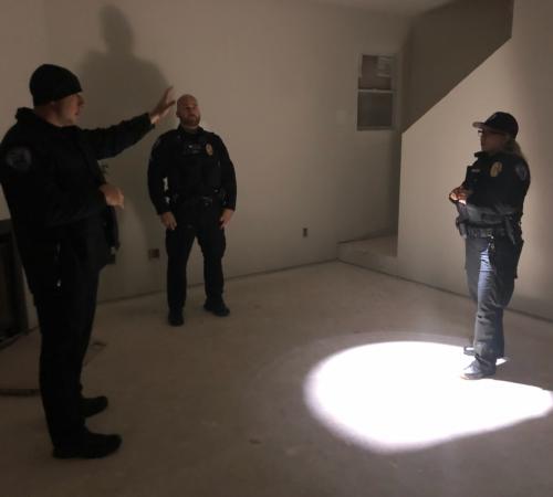 New officer receiving training in building clearing.