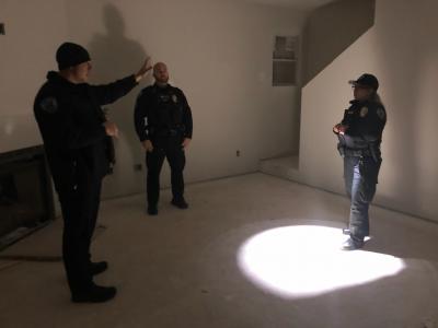 New officer receiving training in building clearing.